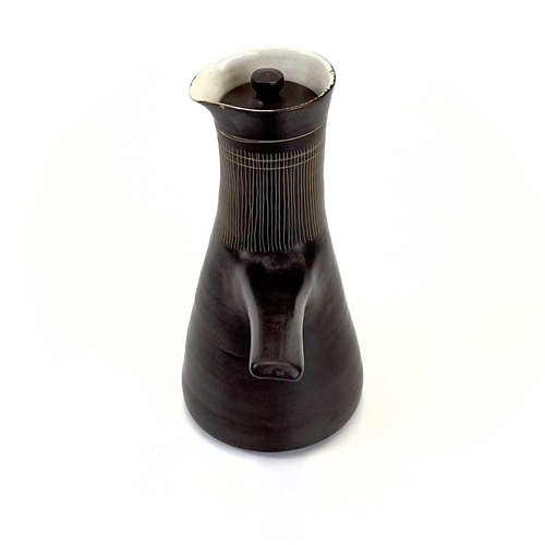 450 - Lucie RIE (1902-1995) Lidded Coffee Pot, circa 1960 With manganese glaze and sgraffito decoration, a... 