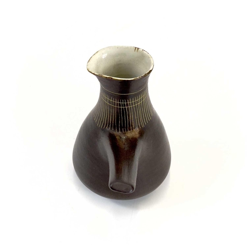 451 - Lucie RIE (1902-1995) Milk Jug, circa 1960 With manganese glaze and sgraffito decoration, and pulled... 