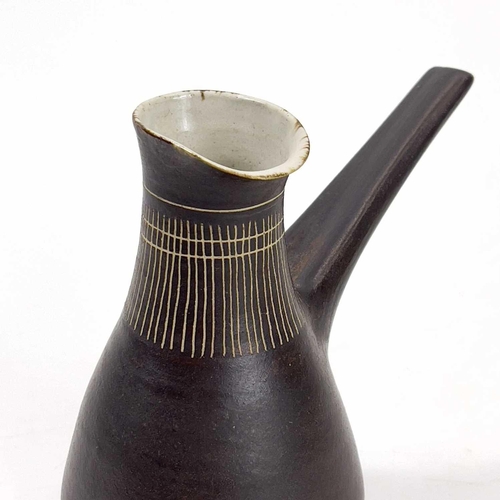 451 - Lucie RIE (1902-1995) Milk Jug, circa 1960 With manganese glaze and sgraffito decoration, and pulled... 