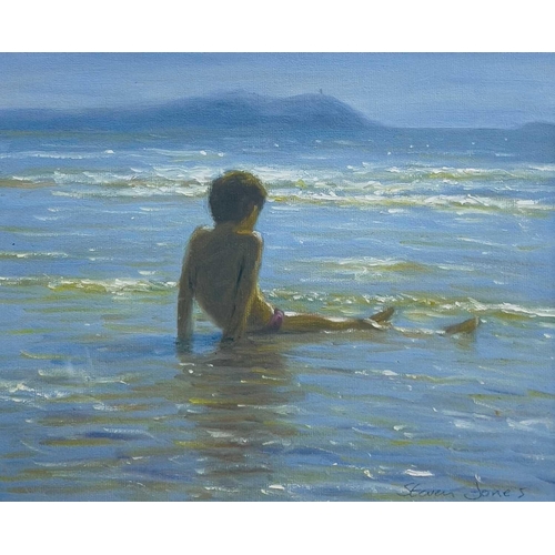 546 - Steven JONES (1959) Child Seated on the Shore Oil on board Signed 23 x 29cm.