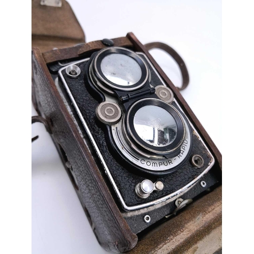 103 - A Rolleiflex DRP DRGM Compur Rapid camera. Together with various Rolleiflex accessories, parts and m... 