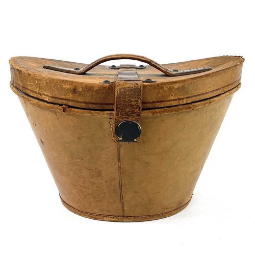 113 - A Victorian silk top hat and leather case. Labelled 15, overall width 33cm.