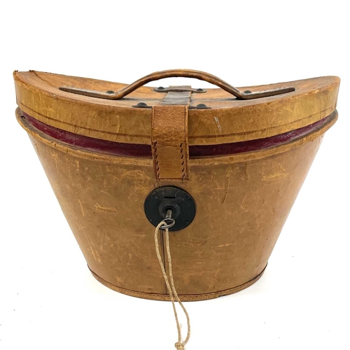 113 - A Victorian silk top hat and leather case. Labelled 15, overall width 33cm.