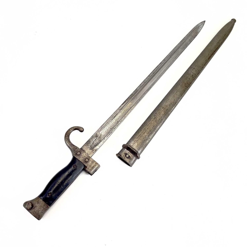 115 - A WWI bayonet and scabbard. With a 40cm straight single fullered blade, downturned quillon, numbered... 