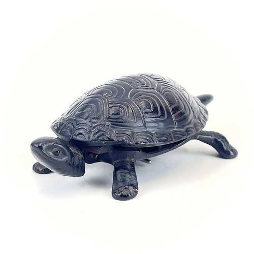 116 - A 20th century German made cast iron counter bell in the form of a tortoise. Length 18cm.