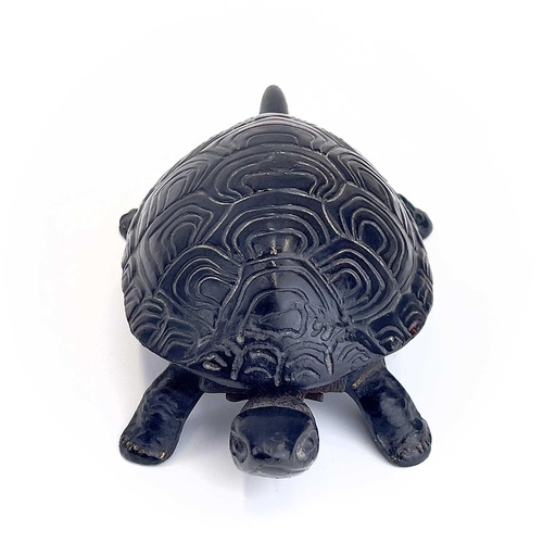 116 - A 20th century German made cast iron counter bell in the form of a tortoise. Length 18cm.