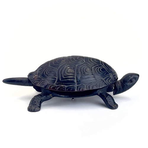 116 - A 20th century German made cast iron counter bell in the form of a tortoise. Length 18cm.