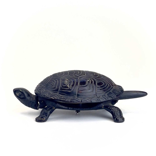 116 - A 20th century German made cast iron counter bell in the form of a tortoise. Length 18cm.