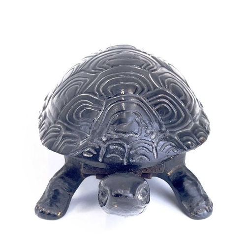 116 - A 20th century German made cast iron counter bell in the form of a tortoise. Length 18cm.