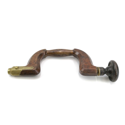 117 - A 19th century beech and brass mounted carpenter's brace stamped Bradshaw. Length 35cm.