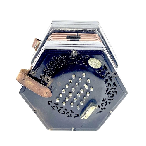 12 - A Lachenal 48 button concertina. Numbered 48857, with pierced ebony ends and nickel buttons, contain... 