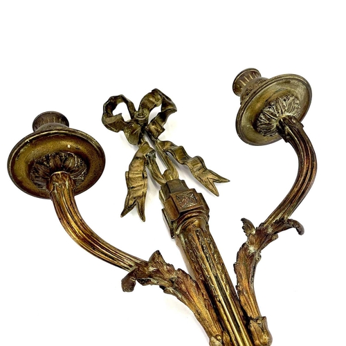 123 - A pair of bronze twin branch candle sconces. French, late 19th century, of Neo-classical design, wit... 