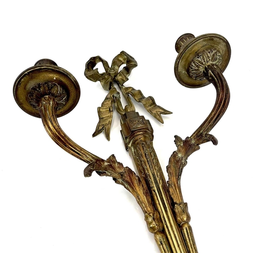 123 - A pair of bronze twin branch candle sconces. French, late 19th century, of Neo-classical design, wit... 