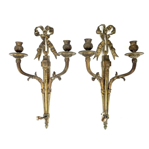 123 - A pair of bronze twin branch candle sconces. French, late 19th century, of Neo-classical design, wit... 