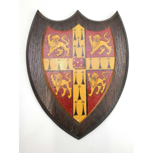 130 - A heraldic shield by A.W. Crisp & Co of Cambridge together with other items. Including two Indian br... 