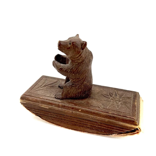 134 - A Black Forest carved blotter surmounted by a seated bear. Height 10cm. Together with a late19th/ear... 