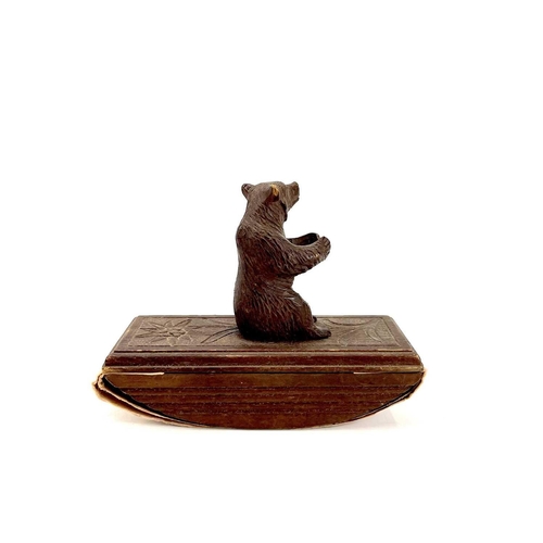 134 - A Black Forest carved blotter surmounted by a seated bear. Height 10cm. Together with a late19th/ear... 