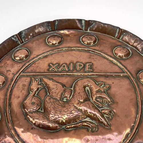 136 - An Arts and Crafts Hayle copper tray of circular form, Diameter 28.25cm, another copper tray embosse... 