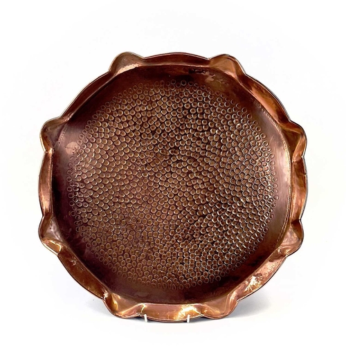 136 - An Arts and Crafts Hayle copper tray of circular form, Diameter 28.25cm, another copper tray embosse... 