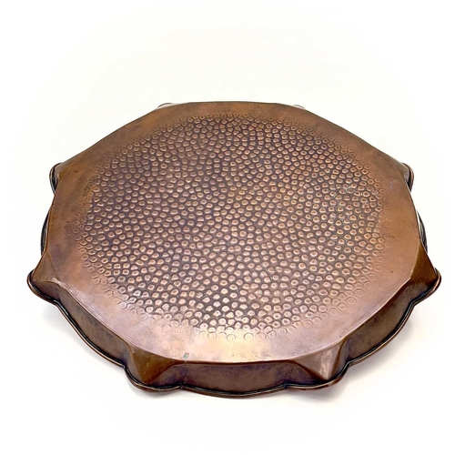 136 - An Arts and Crafts Hayle copper tray of circular form, Diameter 28.25cm, another copper tray embosse... 