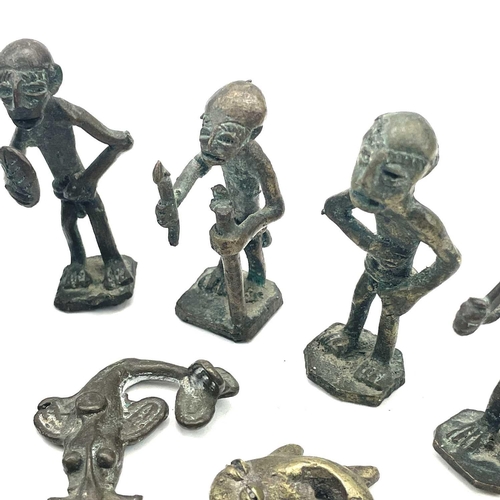 138 - Eight Ashanti bronze small figures. Late 19th/early 20th century, the largest height 6cm, together w... 