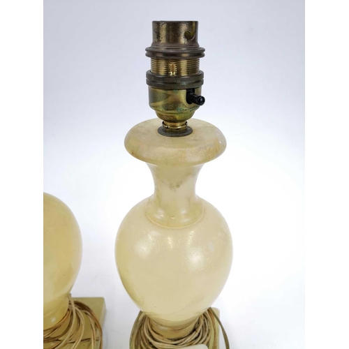 139 - An alabaster table lamp base in the form of a column. Height 41cm, another alabaster lamp base in th... 