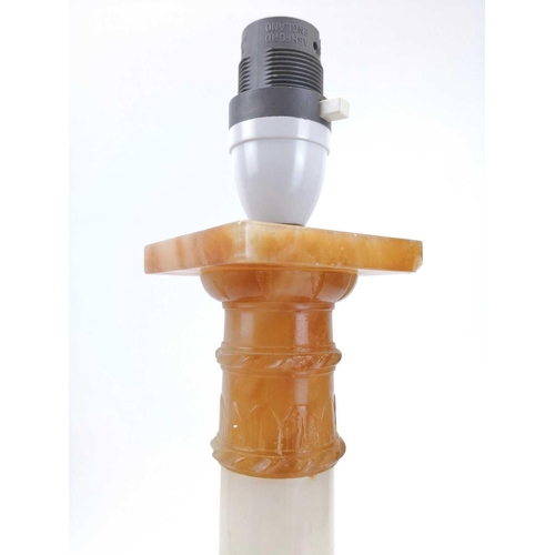 139 - An alabaster table lamp base in the form of a column. Height 41cm, another alabaster lamp base in th... 