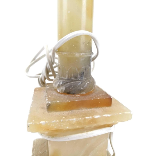 139 - An alabaster table lamp base in the form of a column. Height 41cm, another alabaster lamp base in th... 