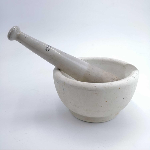 140 - A mortar and pestle of large proportions. The pestle stamped 'MERITOR MAW BARNET'. Length of pestle ... 