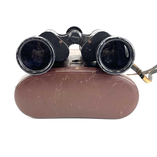 141 - A pair of Carl Zeiss Jena Jenoptem 7 x 50 W binoculars. With brown leather case.