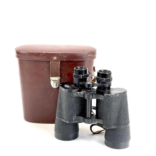 141 - A pair of Carl Zeiss Jena Jenoptem 7 x 50 W binoculars. With brown leather case.