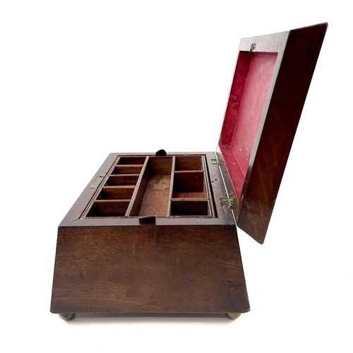 145 - A Victorian mahogany work box of sarcophagus form. With removable interior tray, raised on bun feet.... 