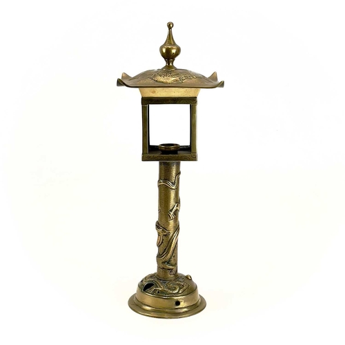 153 - A Japanese brass lantern type table lamp. Cast with dragons and birds, height 44cm.