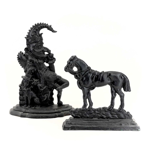 16 - A Victorian cast iron doorstop of a horse. Width 23.5cm, together with another of Mr. Punch, height ... 