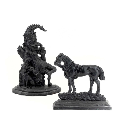 16 - A Victorian cast iron doorstop of a horse. Width 23.5cm, together with another of Mr. Punch, height ... 