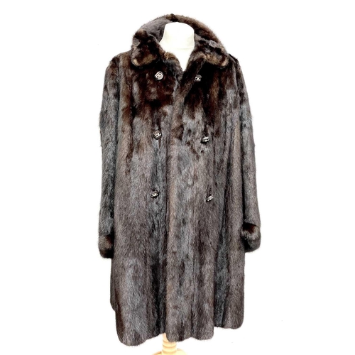 1605 - A Black Diamond 3/4 length mink fur coat. Together with a mink shawl. (2)There are no condition issu... 