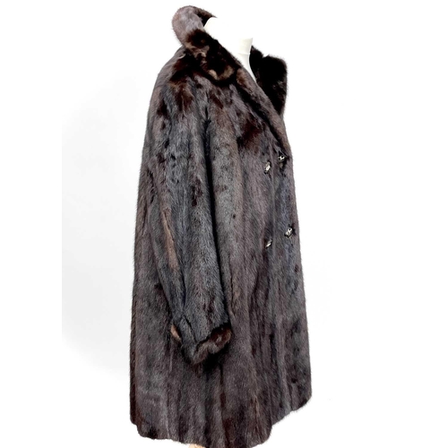 1605 - A Black Diamond 3/4 length mink fur coat. Together with a mink shawl. (2)There are no condition issu... 