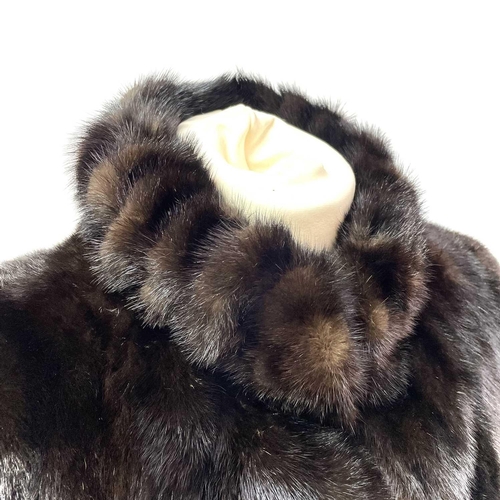 1606 - A Grosvenor Canada (exclusive to Harrods) mink half-length fur jacket. Together with a matching hat ... 