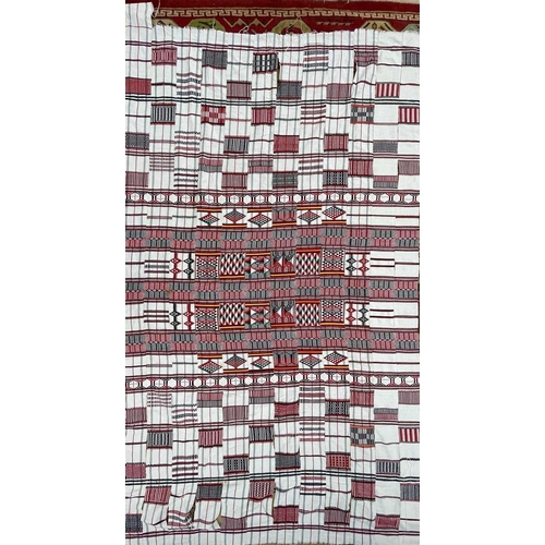 1611 - A cotton African textile with geometric designs. 135cm x 230cm, together with two other African text... 