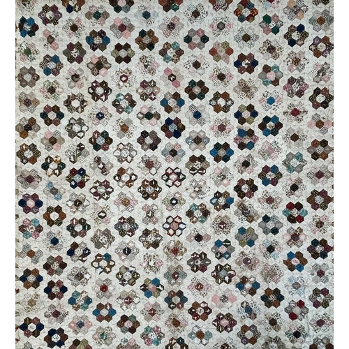 1612 - An early 20th century honeycomb patchwork quilt. 180cm x 160cm.