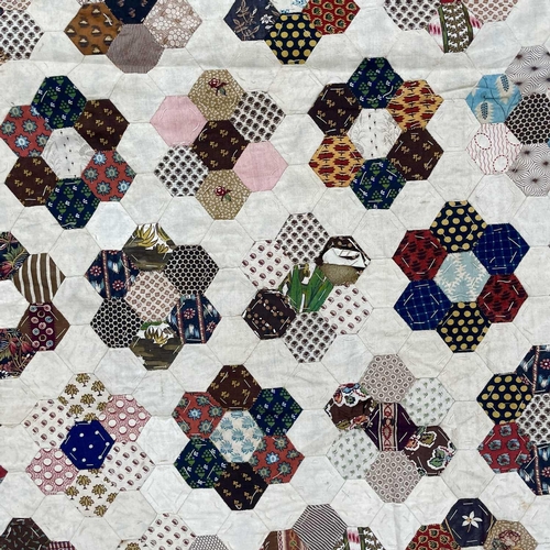 1612 - An early 20th century honeycomb patchwork quilt. 180cm x 160cm.