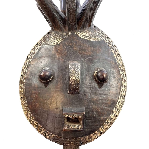 166 - A Kple-Kple Goli Mask. With elaborate horns, and surmounted by a further horned figure, Baale, Ivory... 