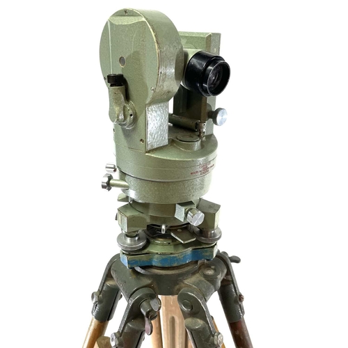 167 - A Vickers Instruments Cooke V11 theodolite, with tripod and measure. (3)