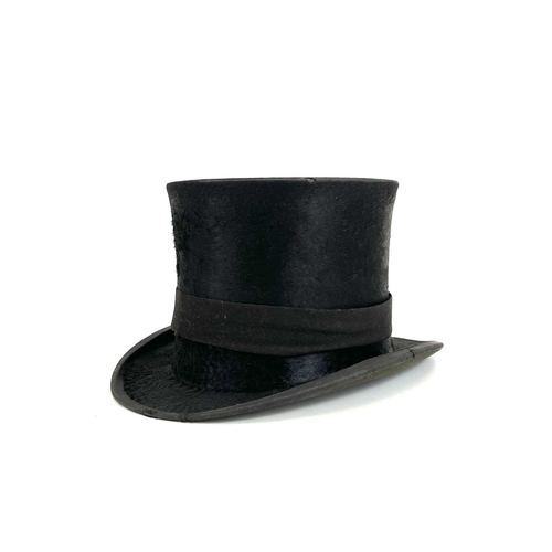 168 - A Victorian top hat, labelled for 'H.Smith, Hatter, Penzance', in leather case.