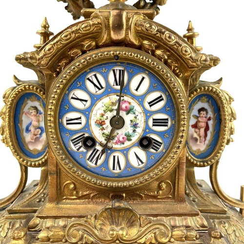 1705 - A French gilt spelter mantel clock. 19th century, with turquoise Paris porcelain mounts including ch... 