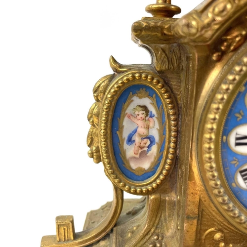 1705 - A French gilt spelter mantel clock. 19th century, with turquoise Paris porcelain mounts including ch... 