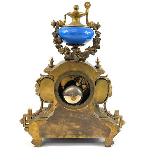 1705 - A French gilt spelter mantel clock. 19th century, with turquoise Paris porcelain mounts including ch... 