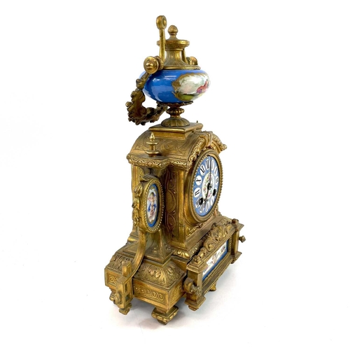 1705 - A French gilt spelter mantel clock. 19th century, with turquoise Paris porcelain mounts including ch... 