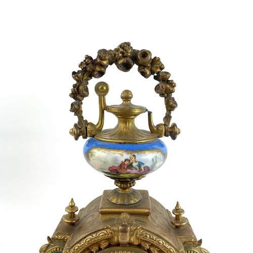 1705 - A French gilt spelter mantel clock. 19th century, with turquoise Paris porcelain mounts including ch... 