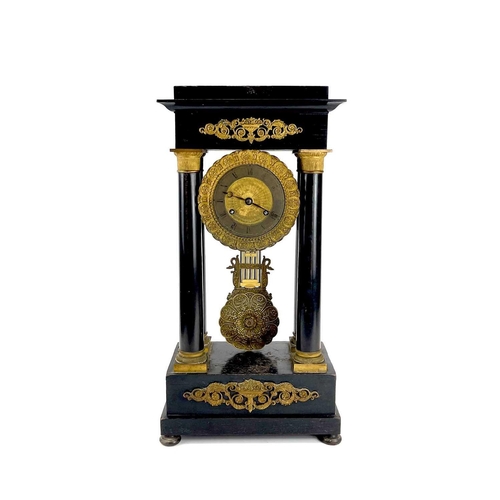 1709 - A French ebonised and ormolu portico clock. 19th century, with gilt capped tapered column supports, ... 